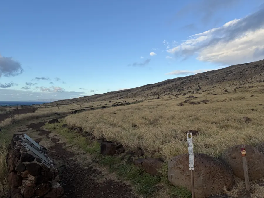 Looking up the trail from the East trailhead parking area, ocean behind.