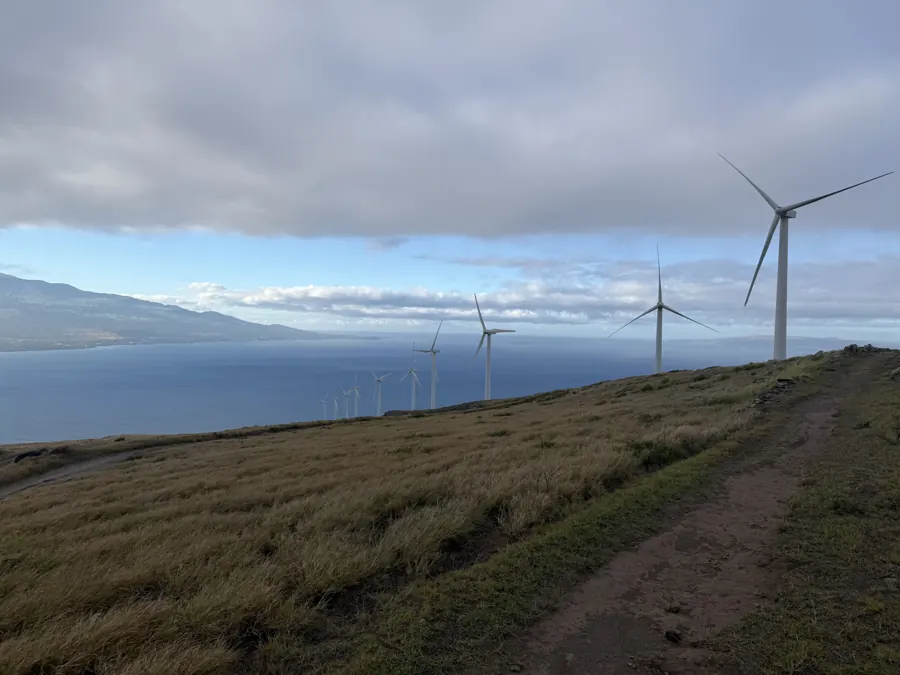 Kaheawa Wind Farm turbines along the ridge, looking down the West Maui coast.